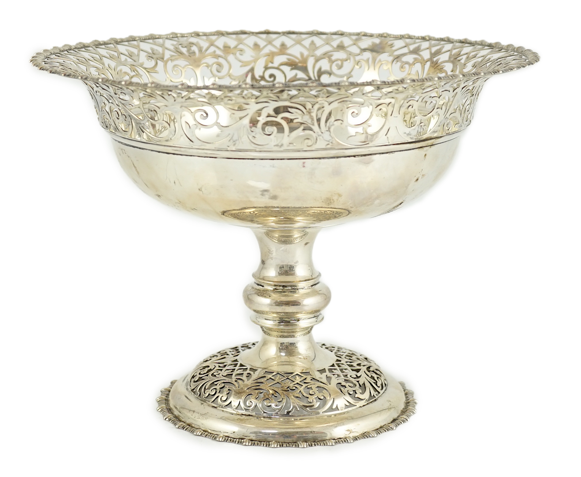 An Edwardian silver pedestal fruit bowl, with pierced border and pierced circular foot, by James Dixon & Sons